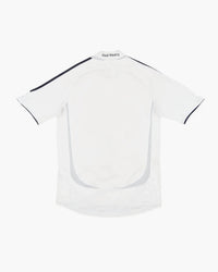 Real Madrid hand-embroidered football shirt in white / purple, back view — CRID