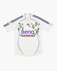 Real Madrid hand-embroidered football shirt in white / purple, front view — CRID