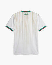 Algeria 2026 home football shirt in off-white with a sand geometric pattern and green Arabic script at the collar, back view, blank for name and number — CRID
