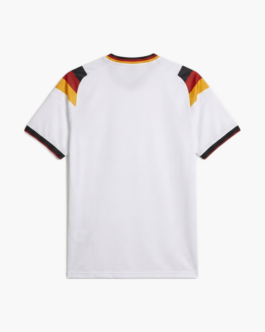 Germany 2026 home football shirt in white with black, red and gold shoulder panels, back view, blank for name and number — CRID