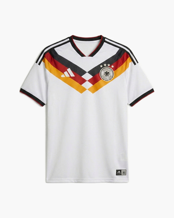 Germany 2026 home football shirt by adidas, white with a black, red and gold chevron across the chest, the DFB crest with four stars and the adidas logo, front view — CRID