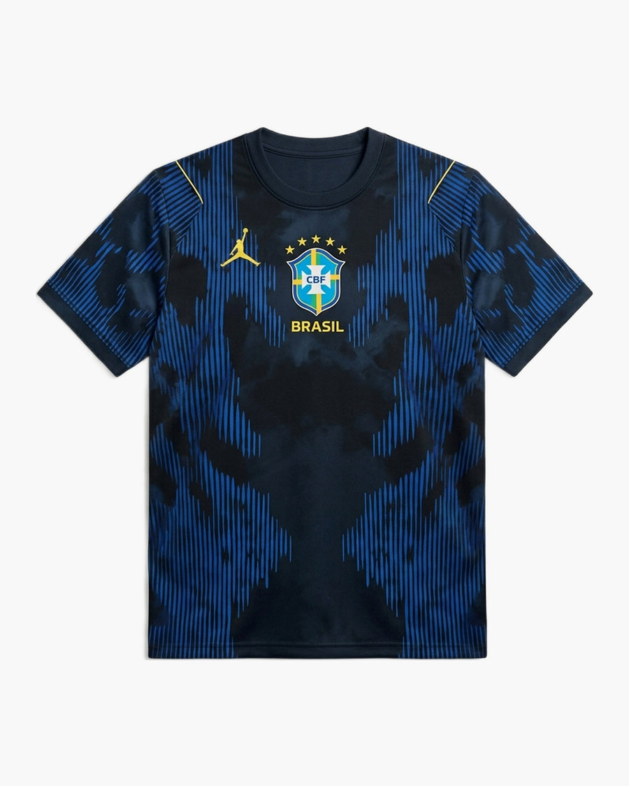 Brazil 2026 away football shirt by Nike, navy blue with a tonal royal blue stripe pattern, the yellow Jumpman logo and the CBF crest with five stars above BRASIL, front view — CRID