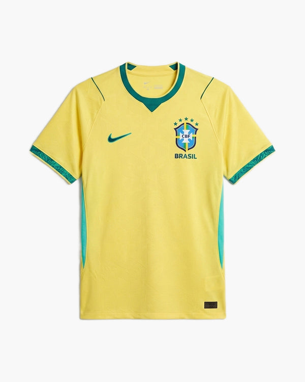 Brazil 2026 home football shirt by Nike, yellow with green trim and side panels, the CBF crest with five stars above BRASIL and the Swoosh, front view — CRID