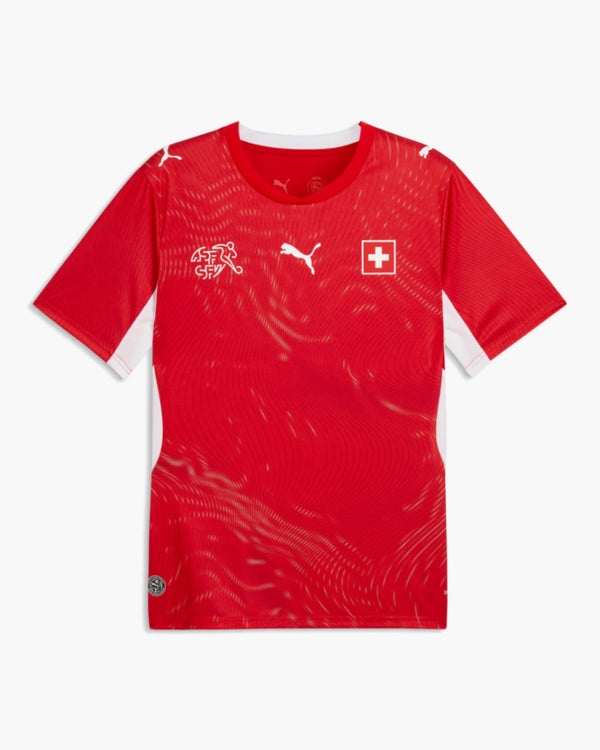 Switzerland 2026 home football shirt, Puma red with a tone-on-tone wave pattern, white side panels, the ASF/SFV crest and the Swiss cross, front view — CRID