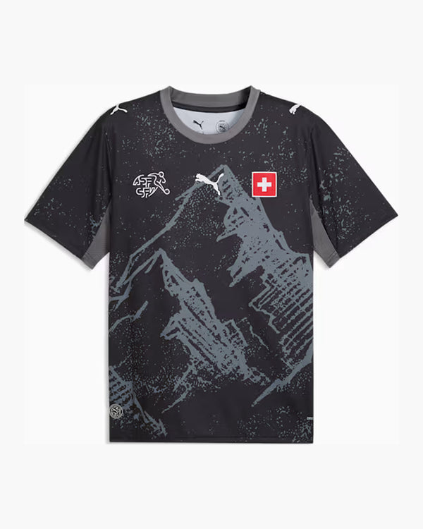 Switzerland 2026 goalkeeper shirt, PUMA x Salehe Bembury, black with a grey print of the Swiss Alps, cool dark grey panels, the ASF/SFV crest and the Swiss cross, front view — CRID