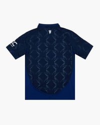 Manchester United hand-embroidered football shirt in navy / blue, back view — CRID